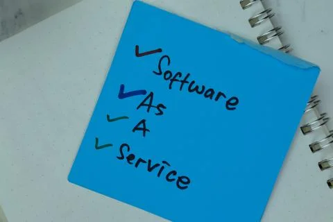Software As A Service write on sticky notes isolated on Wooden Table. Stock Photos