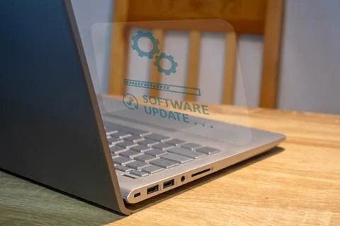 Software system update process concept. A laptop on the table with updating.. Stock Photos