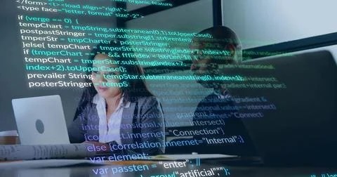 Software team analyzing code on glass screen in tech workspace, with laptop Stock Photos