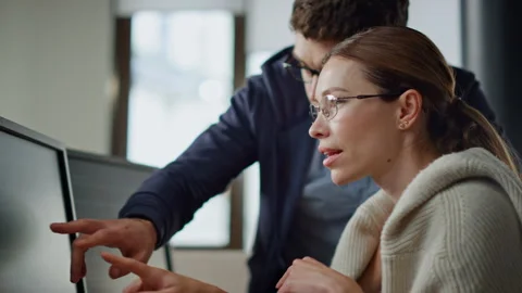 Software team consulting office closeup. It engineer supervisor teaching intern Stock Footage 242984422