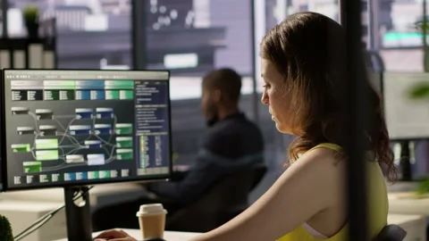 Software technician developing and maintaining databases at work Stock Footage 318160205