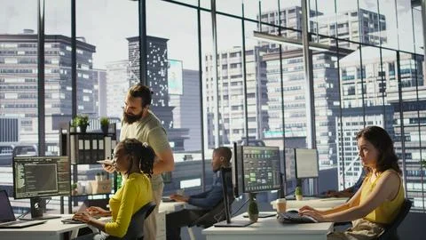 Software technician developing and maintaining databases at work Foto stock