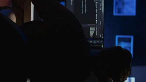 Software technician frustrated while updating complex binary code Stock Footage 265108802