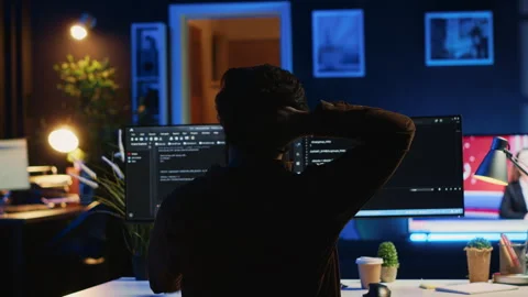 Software technician frustrated while updating complex binary code Stock Footage 265511088