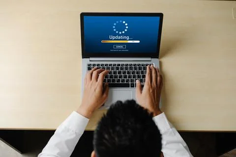 Software update on computer for modish version of device software Stock Photos