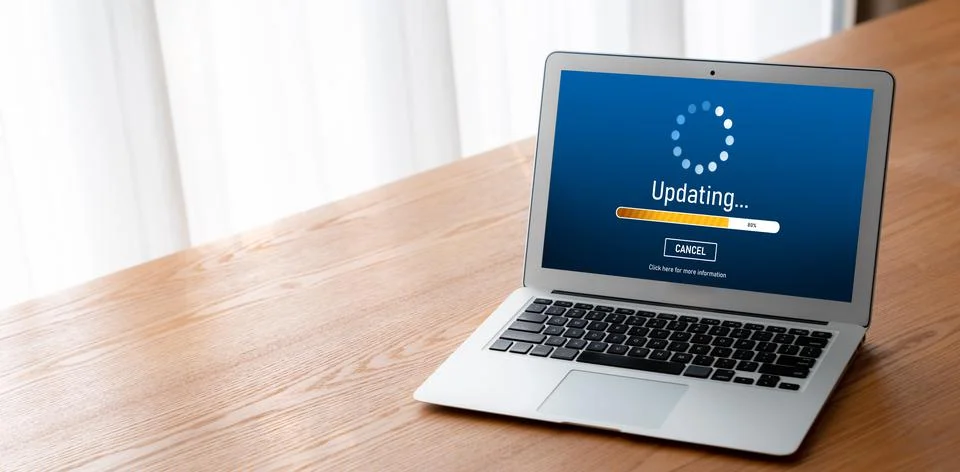 Software update on computer for modish version of device software Stock Photos