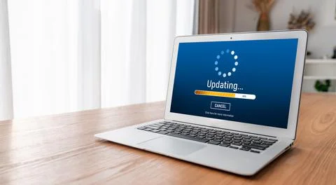 Software update on computer for modish version of device software Stock Photos