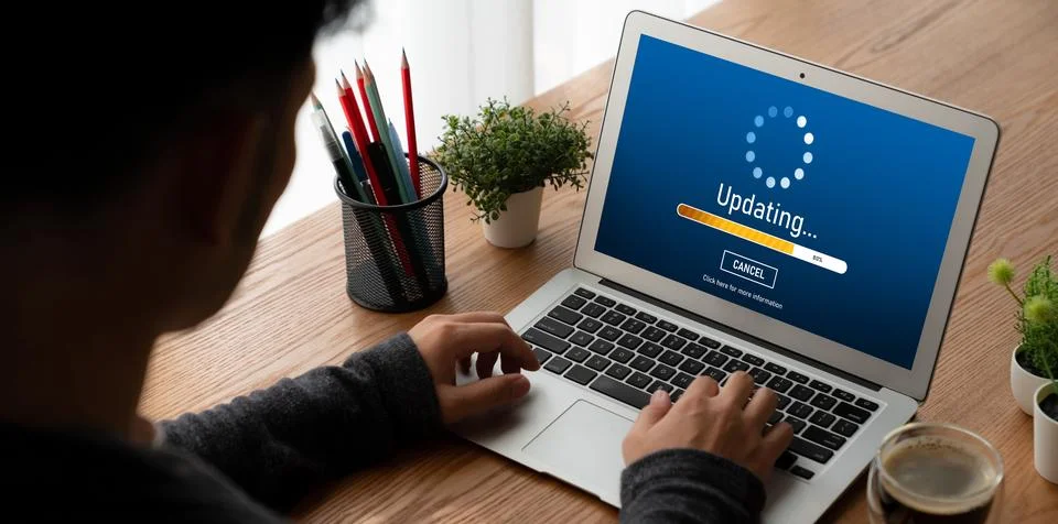 Software update on computer for modish version of device software Stock Photos