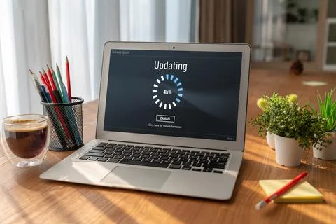 Software update on computer for modish version of device software Stock Photos