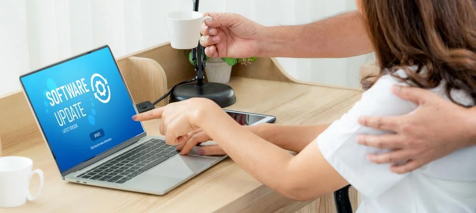 Software update on computer for modish version of device software Stock Photos