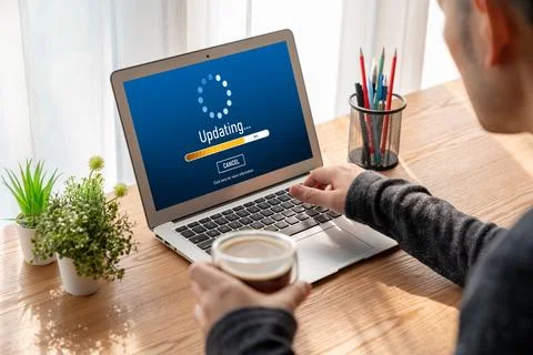 Software update on computer for modish version of device software Stock Photos