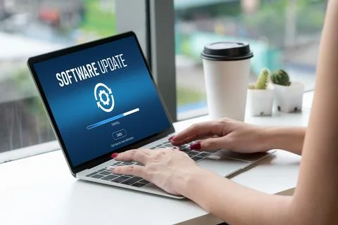 Software update on computer for modish version of device software Stockfoto's