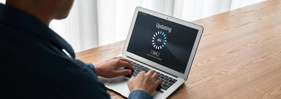 Software update on computer for modish version of device software Stock Photos