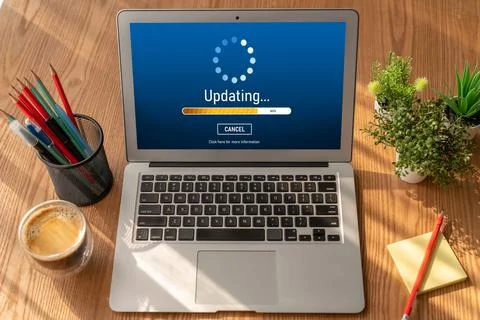 Software update on computer for modish version of device software Stock Photos