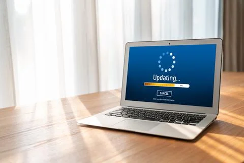 Software update on computer for modish version of device software Stock Photos
