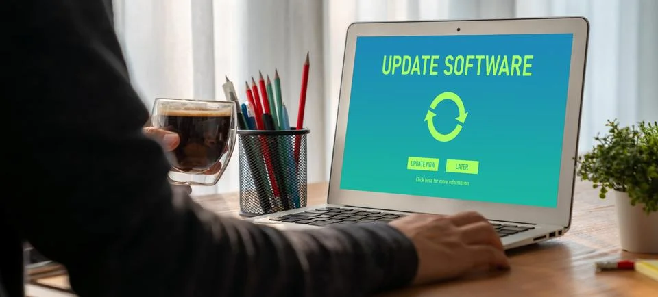 Software update on computer for modish version of device software Stock Photos
