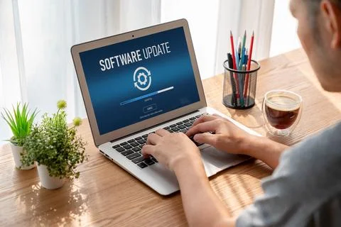 Software update on computer for modish version of device software Stock Photos