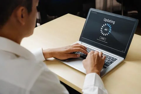 Software update on computer for modish version of device software Stock Photos