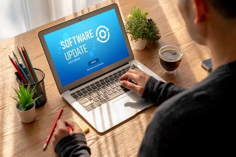 Software update on computer for modish version of device software Stock Photos