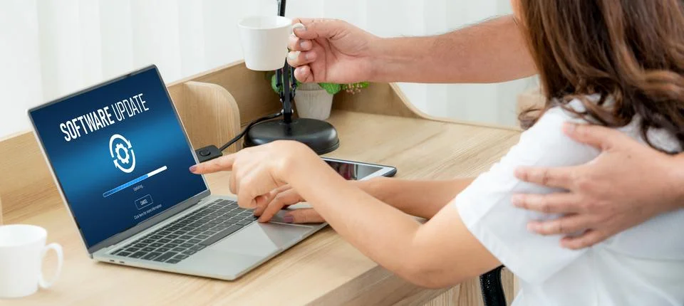 Software update on computer for modish version of device software Stock Photos