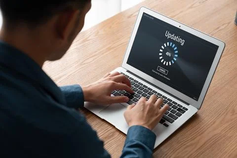 Software update on computer for modish version of device software Stock Photos