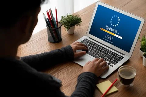 Software update on computer for modish version of device software Stock Photos