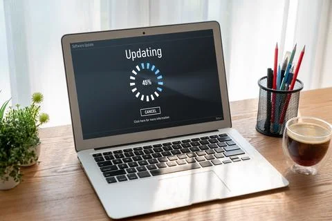 Software update on computer for modish version of device software Stock Photos