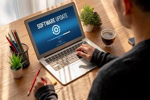 Software update on computer for modish version of device software Stock Photos