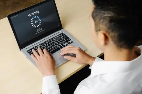 Software update on computer for modish version of device software Stock Photos