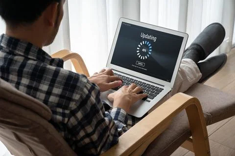 Software update on computer for modish version of device software Stock Photos