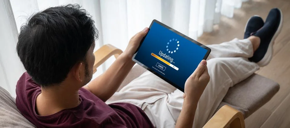 Software update on computer for modish version of device software Stock Photos