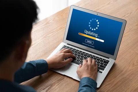 Software update on computer for modish version of device software Stock Photos