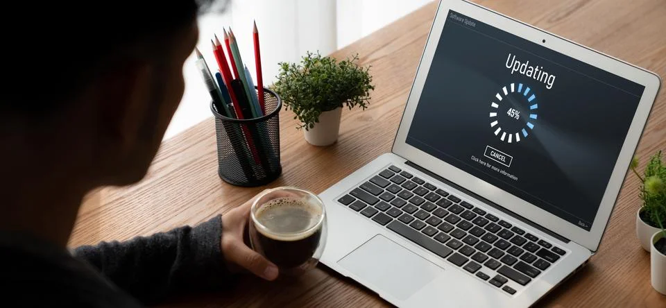 Software update on computer for modish version of device software Stock Photos