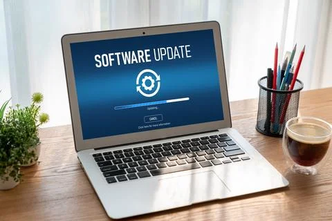 Software update on computer for modish version of device software Stock Photos