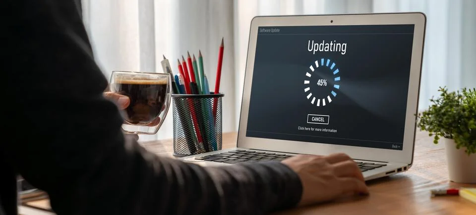 Software update on computer for modish version of device software Stock Photos