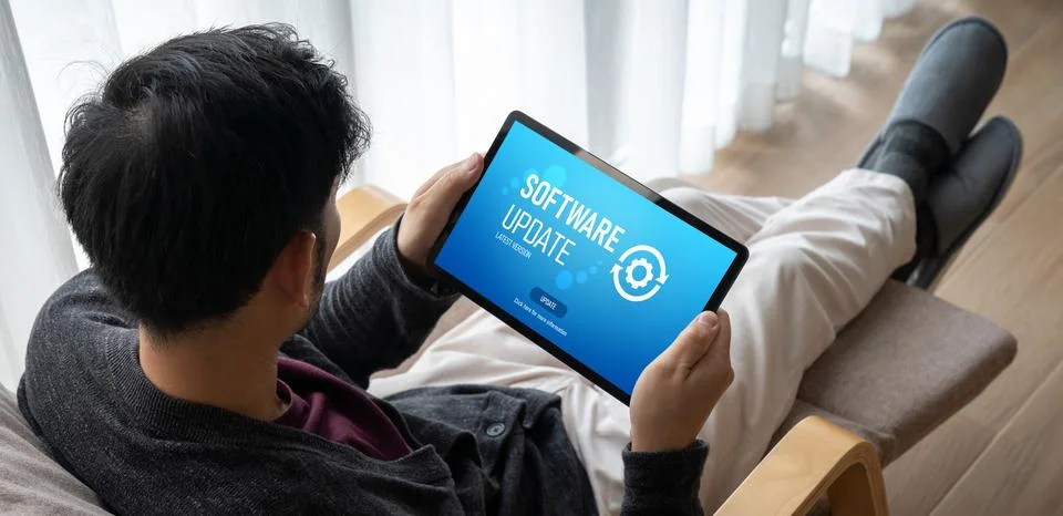 Software update on computer for modish version of device software Stock Photos