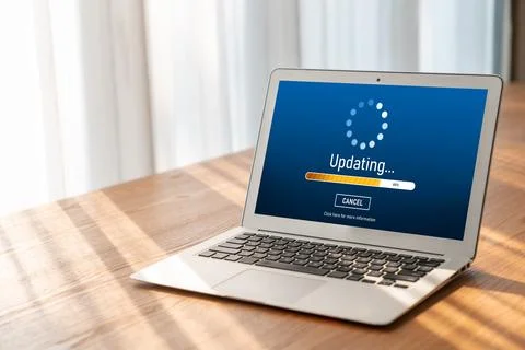 Software update on computer for modish version of device software Stock Photos
