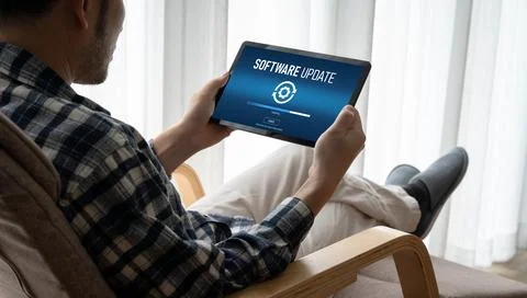Software update on computer for modish version of device software Stock Photos