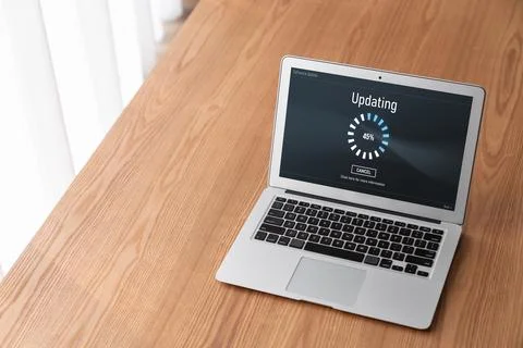 Software update on computer for modish version of device software Stock Photos