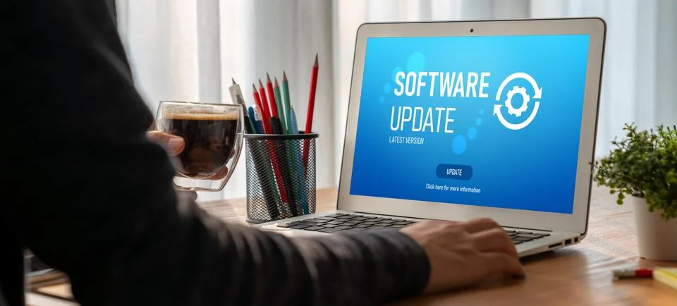 Software update on computer for modish version of device software Stock Photos