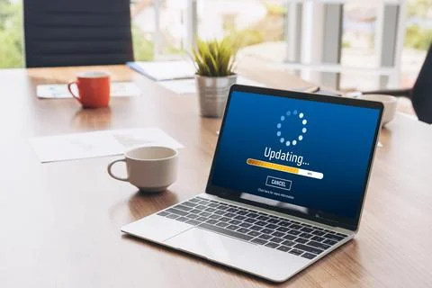 Software update on computer for modish version of device software Stock Photos