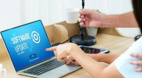 Software update on computer for modish version of device software Stock Photos