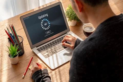 Software update on computer for modish version of device software Stock Photos