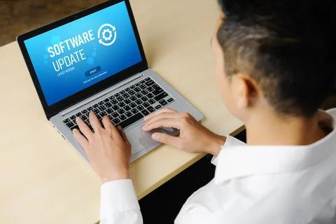 Software update on computer for modish version of device software Stock Photos