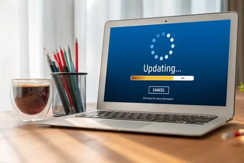 Software update on computer for modish version of device software Stock Photos