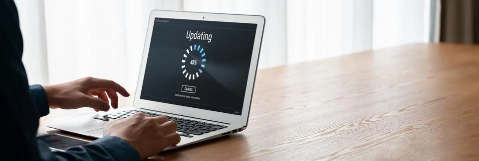 Software update on computer for modish version of device software Stock Photos