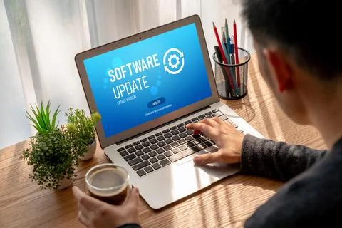 Software update on computer for modish version of device software Stock Photos