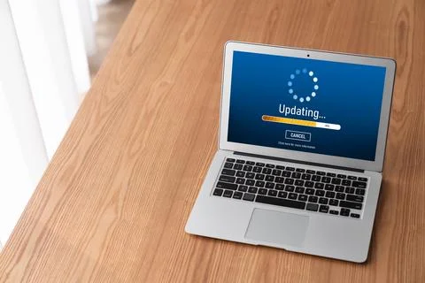 Software update on computer for modish version of device software Stock Photos