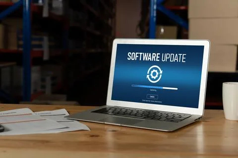 Software update on computer for modish version of device software Stock Photos