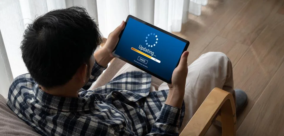 Software update on computer for modish version of device software Stock Photos